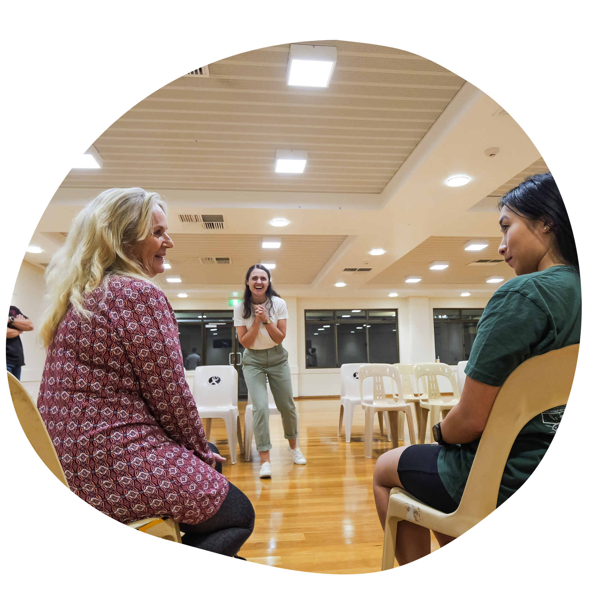 Two women in an improv class at a community hall