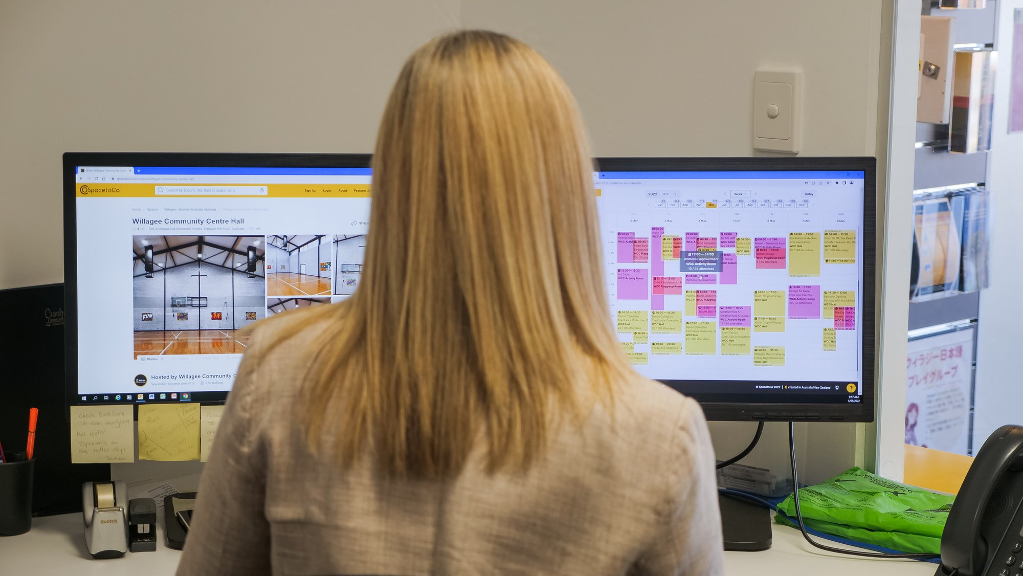 Woman using SpacetoCo on two screens