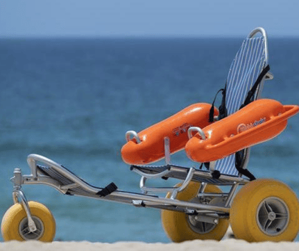 Mobi-Chair floating beach wheelchair with balloon tyres on sand at South Beach Fremantle, bookable on SpacetoCo