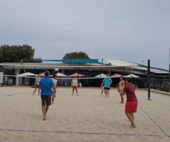 People playing beach volleyball on a sand court at Floreat Beach Volleyball Courts, bookable on SpacetoCo