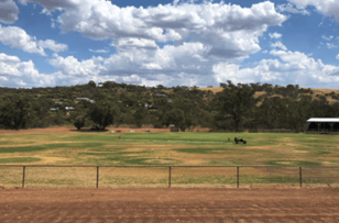 Green sports oval surrounded by hills at the Toodyay Showgrounds, bookable on SpacetoCo